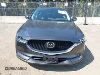 2020 Mazda CX-5 Touring with VIN JM3KFBCM6L1828691, listed as a IAAI auction lot 42100409 with 25,182 mi miles. Bid and sale history available at carsss.com. Image 12.