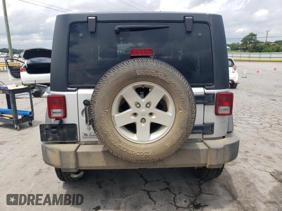 2012 Jeep Wrangler Sport z VIN 1C4AJWAG4CL185009, wystawiony jako Copart lot #61203395 z przebiegiem 93 534 mil mil oraz Szkoda całkowita • Salvage title. Historia ofert i sprzedaży dostępna na DreamBid. Obrazek 6.