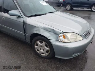 1999 Honda Civic EX with VIN 1HGEJ8643XL010821, listed as a IAAI auction lot 41602036 with 165,139 mi miles. Bid and sale history available at carsss.com. Image 6.