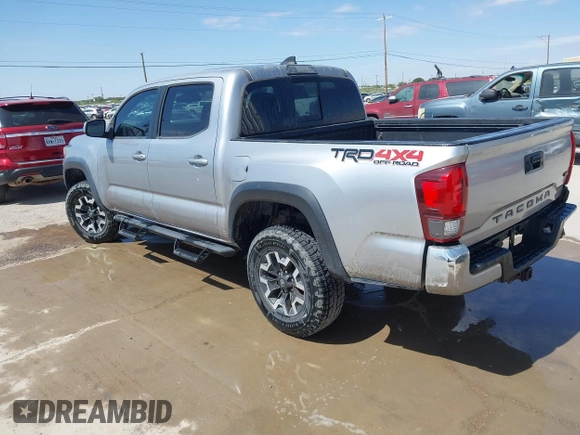 2018 Toyota Tacoma SR with VIN 3TMCZ5AN3JM170037, listed as a IAAI auction lot 42565385 with 157,450 mi miles and . Bid and sale history available at DreamBid. Image 3.