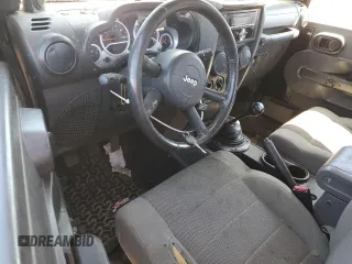 2007 Jeep Wrangler Sahara z VIN 1J4FA54177L183617, wystawiony jako Copart lot #49660785 z przebiegiem 178 846 mil mil oraz Szkoda całkowita • Salvage title. Historia ofert i sprzedaży dostępna na DreamBid. Obrazek 8.