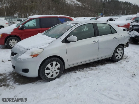 2011 Toyota Yaris with VIN JTDBT4K37B1401590, listed as a Copart auction lot 46142555 with 165,082 mi miles and Salvage Title. Bid and sale history available at carsss.com. Image 1.