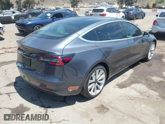 2020 Tesla Model 3 Standard Range Plus with VIN 5YJ3E1EAXLF615781, listed as a IAAI auction lot 42068935 with 96,026 mi miles. Bid and sale history available at carsss.com. Image 4.