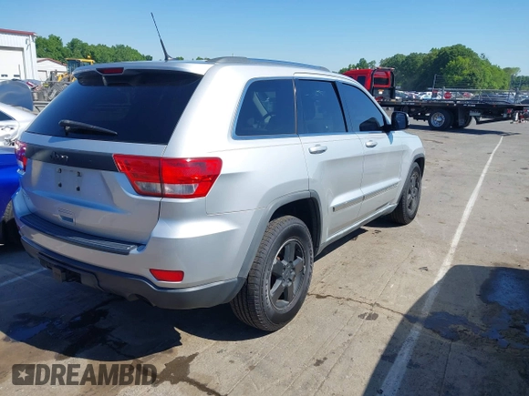 2011 Jeep Grand Cherokee Laredo with VIN 1J4RS4GGXBC513523, listed as a IAAI auction lot 42203802 with 242,239 mi miles and . Bid and sale history available at DreamBid. Image 4.