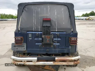 2000 Jeep Wrangler Sport z VIN 1J4FA49S1YP713523, wystawiony jako Copart lot #58076745 z przebiegiem 117 112 mil mil oraz Czysty tytuł • Clean title. Historia ofert i sprzedaży dostępna na DreamBid. Obrazek 6.
