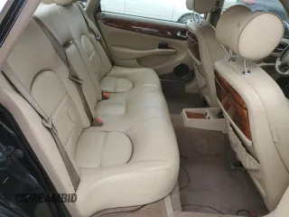 1999 Jaguar XJ z VIN SAJKD6043XC872105, wystawiony jako Copart lot #86270724 z przebiegiem Nie podano mil oraz Szkoda całkowita • Salvage title. Historia ofert i sprzedaży dostępna na DreamBid. Obrazek 10.