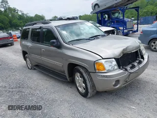 2003 GMC Envoy SLT z VIN 1GKET16P236192874, wystawiony jako IAAI lot #42402163 z przebiegiem 156 030 mil mil oraz . Historia ofert i sprzedaży dostępna na DreamBid. Obrazek 1.