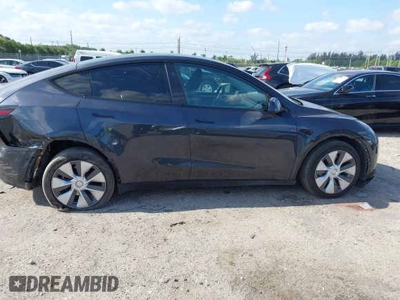 2024 Tesla Model Y Long Range z VIN 7SAYGDEE0RA263842, wystawiony jako IAAI lot #42106339 z przebiegiem 48 447 mil mil oraz . Historia ofert i sprzedaży dostępna na DreamBid. Obrazek 13.