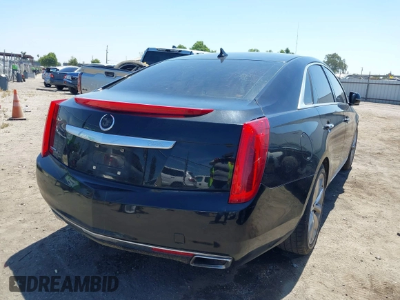 2013 Cadillac XTS Luxury z VIN 2G61R5S32D9226506, wystawiony jako IAAI lot #42208105 z przebiegiem 140 255 mil mil oraz . Historia ofert i sprzedaży dostępna na DreamBid. Obrazek 4.