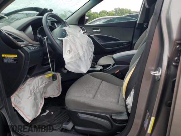 2018 Hyundai Santa Fe 2.4L z VIN 5NMZT3LB2JH104519, wystawiony jako Copart lot #60915715 z przebiegiem Nie podano mil oraz Szkoda całkowita • Salvage title. Historia ofert i sprzedaży dostępna na DreamBid. Obrazek 7.