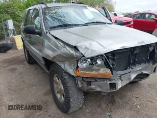 2001 Jeep Grand Cherokee Laredo z VIN 1J4GW48S01C658017, wystawiony jako IAAI lot #42160310 z przebiegiem 220 309 mil mil oraz . Historia ofert i sprzedaży dostępna na DreamBid. Obrazek 6.