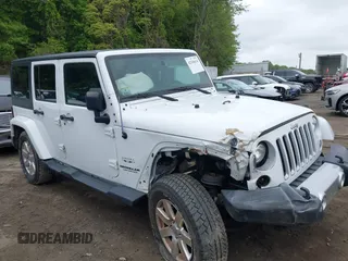 2017 Jeep Wrangler Unlimited Sahara z VIN 1C4HJWEG8HL667661, wystawiony jako IAAI lot #42346614 z przebiegiem 94 175 mil mil oraz . Historia ofert i sprzedaży dostępna na DreamBid. Obrazek 1.