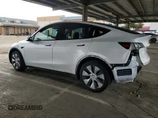 2022 Tesla Model Y Long Range z VIN 7SAYGAEE9NF493262, wystawiony jako Copart lot #52975005 z przebiegiem 63 189 mil mil oraz Szkoda całkowita • Salvage title. Historia ofert i sprzedaży dostępna na DreamBid. Obrazek 2.