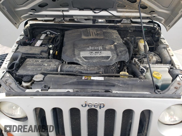 2012 Jeep Wrangler Sport z VIN 1C4AJWAG4CL185009, wystawiony jako Copart lot #61203395 z przebiegiem 93 534 mil mil oraz Szkoda całkowita • Salvage title. Historia ofert i sprzedaży dostępna na DreamBid. Obrazek 12.