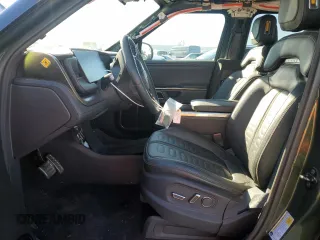 2023 Rivian R1T Adventure with VIN 7FCTGAAA7PN024633, listed as a Copart auction lot 41481365 with 24,965 mi miles and Salvage Title. Bid and sale history available at carsss.com. Image 7.