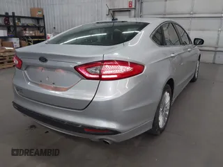 2013 Ford Fusion SE Hybrid with VIN 3FA6P0LU7DR228691, listed as a IAAI auction lot 42055540 with 144,389 mi miles and . Bid and sale history available at DreamBid. Image 4.