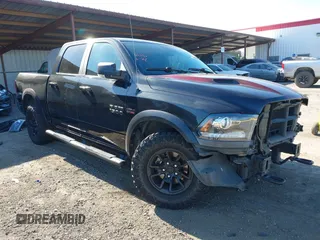 2017 Ram 1500 Rebel z VIN 1C6RR7YT5HS811773, wystawiony jako IAAI lot #41410030 z przebiegiem 96 418 mil mil oraz . Historia ofert i sprzedaży dostępna na DreamBid. Obrazek 1.