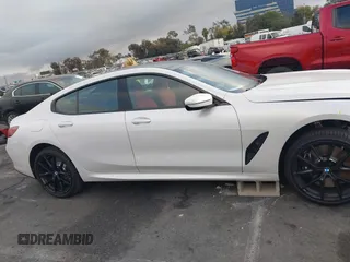 2023 BMW 8 Series 840i z VIN WBAGV2C02PCL77961, wystawiony jako IAAI lot #41156644 z przebiegiem 7059 mil mil oraz . Historia ofert i sprzedaży dostępna na DreamBid. Obrazek 13.