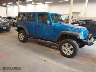 2015 Jeep Wrangler Unlimited Rubicon with VIN 1C4BJWFG7FL661643, listed as a IAAI auction lot 41291385 with 112,785 mi miles. Bid and sale history available at carsss.com. Image 1.