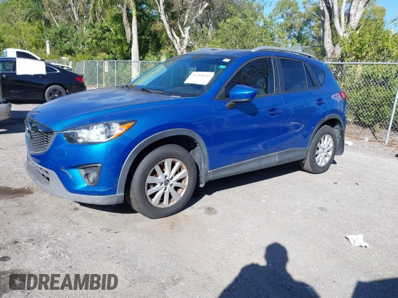 2014 Mazda CX-5 Touring with VIN JM3KE2CYXE0310873, listed as a IAAI auction lot 41309633 with 175,325 mi miles and . Bid and sale history available at DreamBid. Image 2.