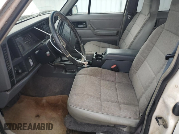 1996 Jeep Cherokee Sport z VIN 1J4FJ68S3TL103684, wystawiony jako Copart lot #63466265 z przebiegiem 163 715 mil mil oraz Czysty tytuł • Clean title. Historia ofert i sprzedaży dostępna na DreamBid. Obrazek 7.