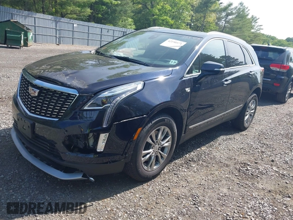 2021 Cadillac XT5 AWD Premium Luxury z VIN 1GYKNDRS8MZ217572, wystawiony jako IAAI lot #42190571 z przebiegiem 25 100 mil mil oraz . Historia ofert i sprzedaży dostępna na DreamBid. Obrazek 17.