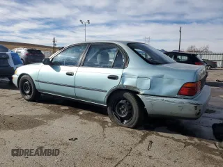 1994 Toyota Corolla Deluxe with VIN JT2AE09B4R0067104, listed as a Copart auction lot 83565064 with 207,923 mi miles and Salvage title. Bid and sale history available at DreamBid. Image 2.