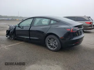 2023 Tesla Model 3 with VIN 5YJ3E1EA9PF687187, listed as a Copart auction lot 61044055 with 7,007 mi miles and Salvage title. Bid and sale history available at DreamBid. Image 2.
