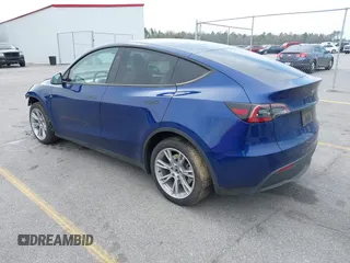 2023 Tesla Model Y Long Range with VIN 7SAYGDEE7PA194998, listed as a IAAI auction lot 41787170 with 16,221 mi miles and . Bid and sale history available at DreamBid. Image 3.