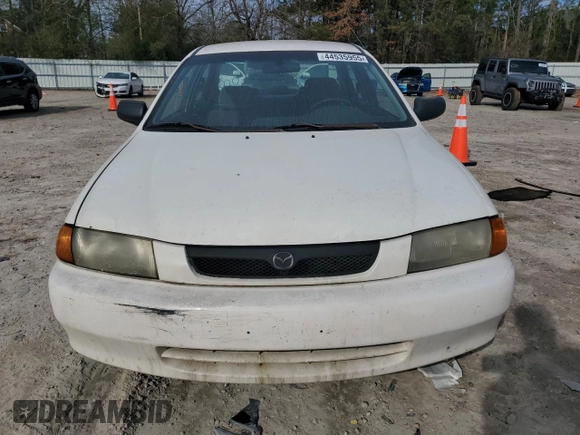 1998 Mazda Protege DX z VIN JM1BC1416W0194406, wystawiony jako Copart lot #44535955 z przebiegiem 312 942 mil mil oraz Szkoda całkowita • Salvage title. Historia ofert i sprzedaży dostępna na DreamBid. Obrazek 5.