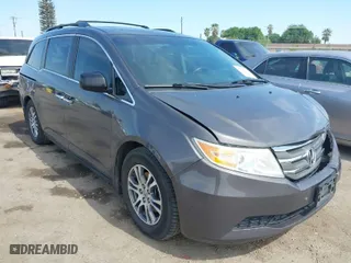 2012 Honda Odyssey EX-L with VIN 5FNRL5H62CB127598, listed as a IAAI auction lot 42025264 with 162,904 mi miles. Bid and sale history available at carsss.com. Image 1.