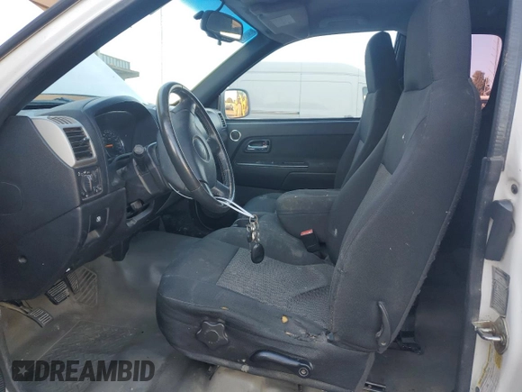 2009 Chevrolet Colorado Work Truck z VIN 1GCCS19E498149120, wystawiony jako Copart lot #72383104 z przebiegiem 296 546 mil mil oraz Szkoda całkowita • Salvage title. Historia ofert i sprzedaży dostępna na DreamBid. Obrazek 7.