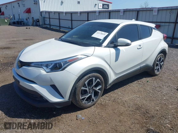2018 Toyota C-HR XLE z VIN NMTKHMBXXJR041817, wystawiony jako IAAI lot #42174035 z przebiegiem 86 669 mil mil oraz . Historia ofert i sprzedaży dostępna na DreamBid. Obrazek 2.