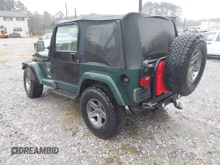 2000 Jeep Wrangler Sahara with VIN 1J4FA59SXYP701098, listed as a IAAI auction lot 41592872 with 1 mi miles. Bid and sale history available at carsss.com. Image 3.