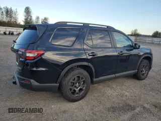 2023 Honda Pilot TrailSport with VIN 5FNYG1H63PB017335, listed as a Copart auction lot 75012154 with 5,870 mi miles and Salvage Title. Bid and sale history available at carsss.com. Image 3.
