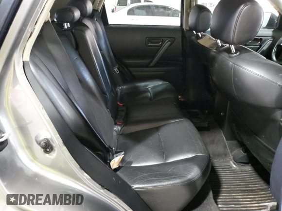 2005 Infiniti FX z VIN JNRAS08W25X200190, wystawiony jako Copart lot #86908434 z przebiegiem 269 591 mil mil oraz Szkoda całkowita • Salvage title. Historia ofert i sprzedaży dostępna na DreamBid. Obrazek 11.