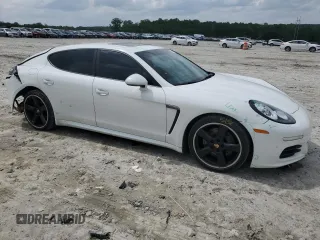 2014 Porsche Panamera z VIN WP0AA2A76EL010143, wystawiony jako Copart lot #54750715 z przebiegiem 132 333 mil mil oraz Szkoda całkowita • Salvage title. Historia ofert i sprzedaży dostępna na DreamBid. Obrazek 4.