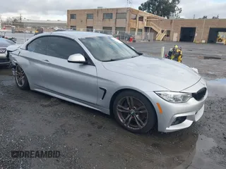 2015 BMW 4 Series 428i with VIN WBA3V7C50FP772915, listed as a IAAI auction lot 41526014 with 116,800 mi miles. Bid and sale history available at carsss.com. Image 1.