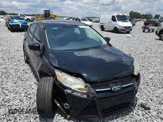 2012 Ford Focus SE z VIN 1FAHP3K25CL248672, wystawiony jako Copart lot #58129345 z przebiegiem 124 687 mil mil oraz Szkoda całkowita • Salvage title. Historia ofert i sprzedaży dostępna na DreamBid. Obrazek 14.