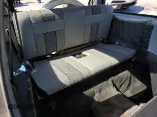 1991 Geo Tracker z VIN 2CNBJ18U3M6909006, wystawiony jako Copart lot #73638944 z przebiegiem 65 033 mil mil oraz Tytuł czysty. Historia ofert i sprzedaży dostępna na DreamBid. Obrazek 11.