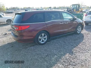 2019 Honda Odyssey EX-L z VIN 5FNRL6H75KB116656, wystawiony jako IAAI lot #41870961 z przebiegiem 87 697 mil mil oraz . Historia ofert i sprzedaży dostępna na DreamBid. Obrazek 4.