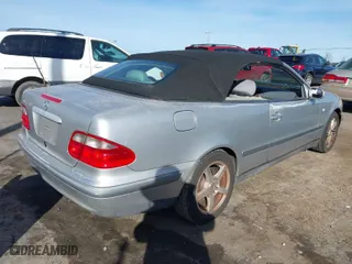 1999 Mercedes-Benz CLK-Class with VIN WDBLK65G6XT006151, listed as a IAAI auction lot 41597025 with 230,751 mi miles. Bid and sale history available at carsss.com. Image 4.