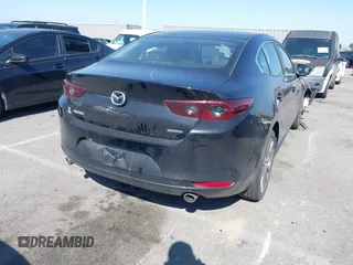 2021 Mazda 3 Select with VIN 3MZBPABL2MM250695, listed as a IAAI auction lot 42001485 with 29,672 mi miles and . Bid and sale history available at DreamBid. Image 4.