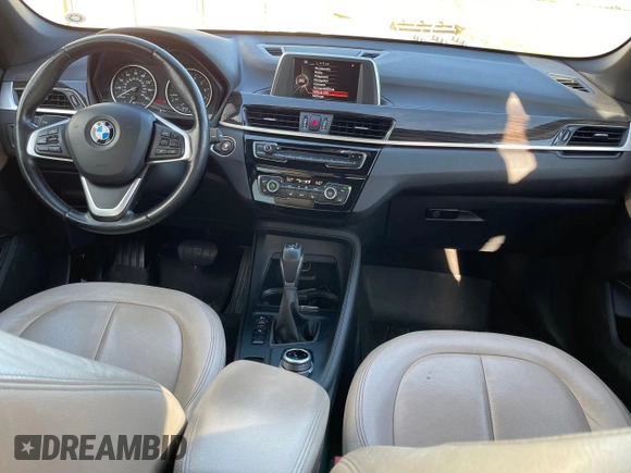 2017 BMW X1 sDrive28i with VIN WBXHU7C39H5H34971, listed as a Copart auction lot 51869265 with 108,051 mi miles and Clean Title. Bid and sale history available at carsss.com. Image 9.