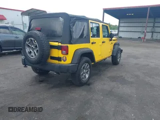 2015 Jeep Wrangler Unlimited Willys Wheeler with VIN 1C4BJWDG2FL643375, listed as a IAAI auction lot 42109724 with 112,357 mi miles and . Bid and sale history available at DreamBid. Image 4.