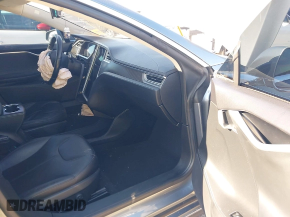 2014 Tesla Model S 60 with VIN 5YJSA1H1XEFP31911, listed as a IAAI auction lot 42029215 with Not Provided miles and . Bid and sale history available at DreamBid. Image 5.