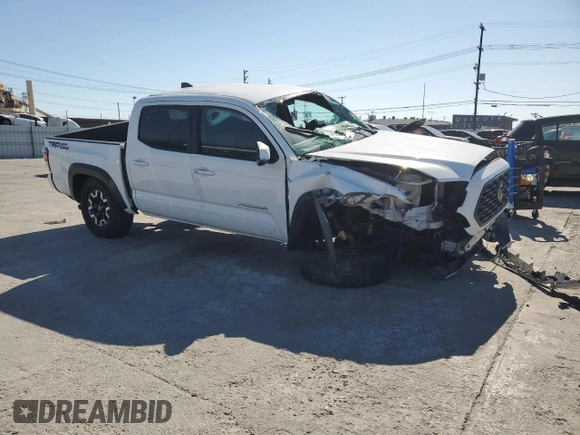 2020 Toyota Tacoma SR5 with VIN 3TMAZ5CN8LM115056, listed as a Copart auction lot 46948805 with 87,713 mi miles and Salvage title. Bid and sale history available at DreamBid. Image 4.