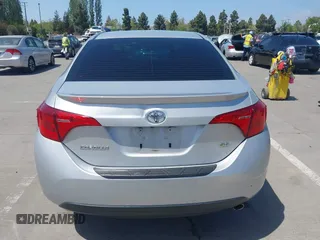 2019 Toyota Corolla L with VIN 5YFBURHE5KP877691, listed as a IAAI auction lot 42108591 with 85,813 mi miles and . Bid and sale history available at DreamBid. Image 16.