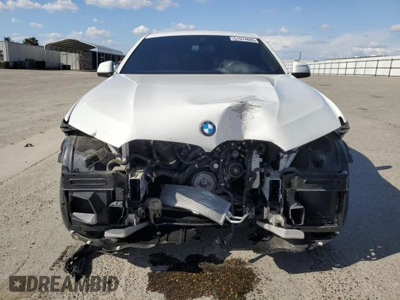 2023 BMW X6 xDrive40i z VIN 5UXCY6C04P9P49005, wystawiony jako Copart lot #51974695 z przebiegiem 30 421 mil mil oraz Szkoda całkowita • Salvage title. Historia ofert i sprzedaży dostępna na DreamBid. Obrazek 5.