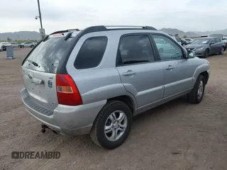 2005 Kia Sportage LX with VIN KNDJE723557070596, listed as a IAAI auction lot 42008414 with 215,204 mi miles and . Bid and sale history available at carsss.com. Image 4.